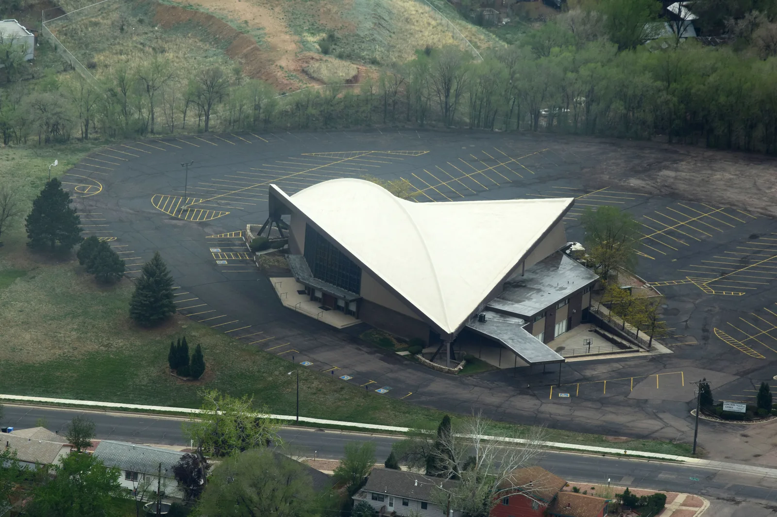 Commercial flat-roof project in Colorado Springs by Total Restoration & Roofing — TPO / EPDM / modified-bitumen systems for offices, retail, industrial, and church buildings