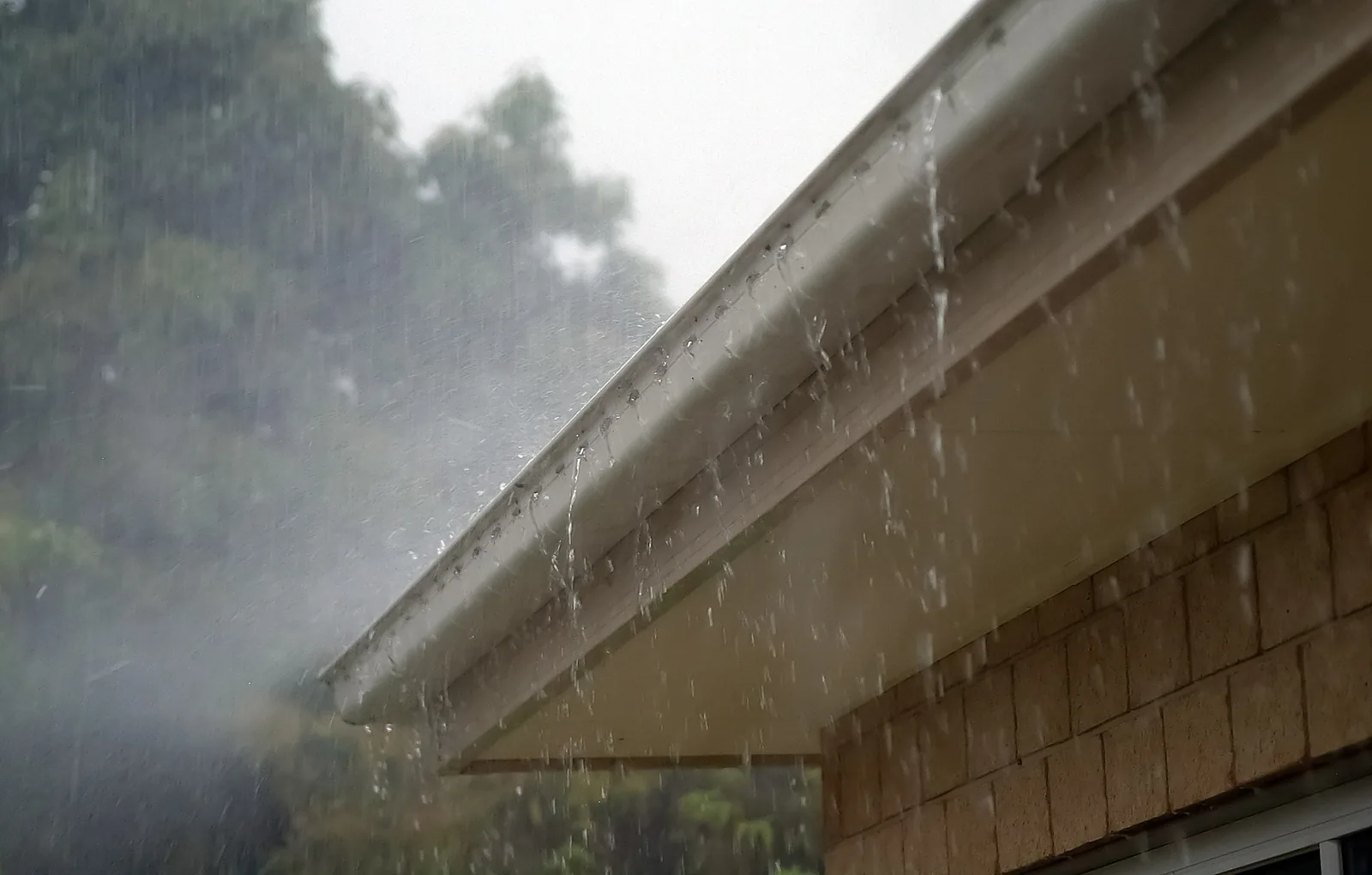 Seamless .032 aluminum K-style gutter installation on a Colorado Springs home by Total Restoration & Roofing