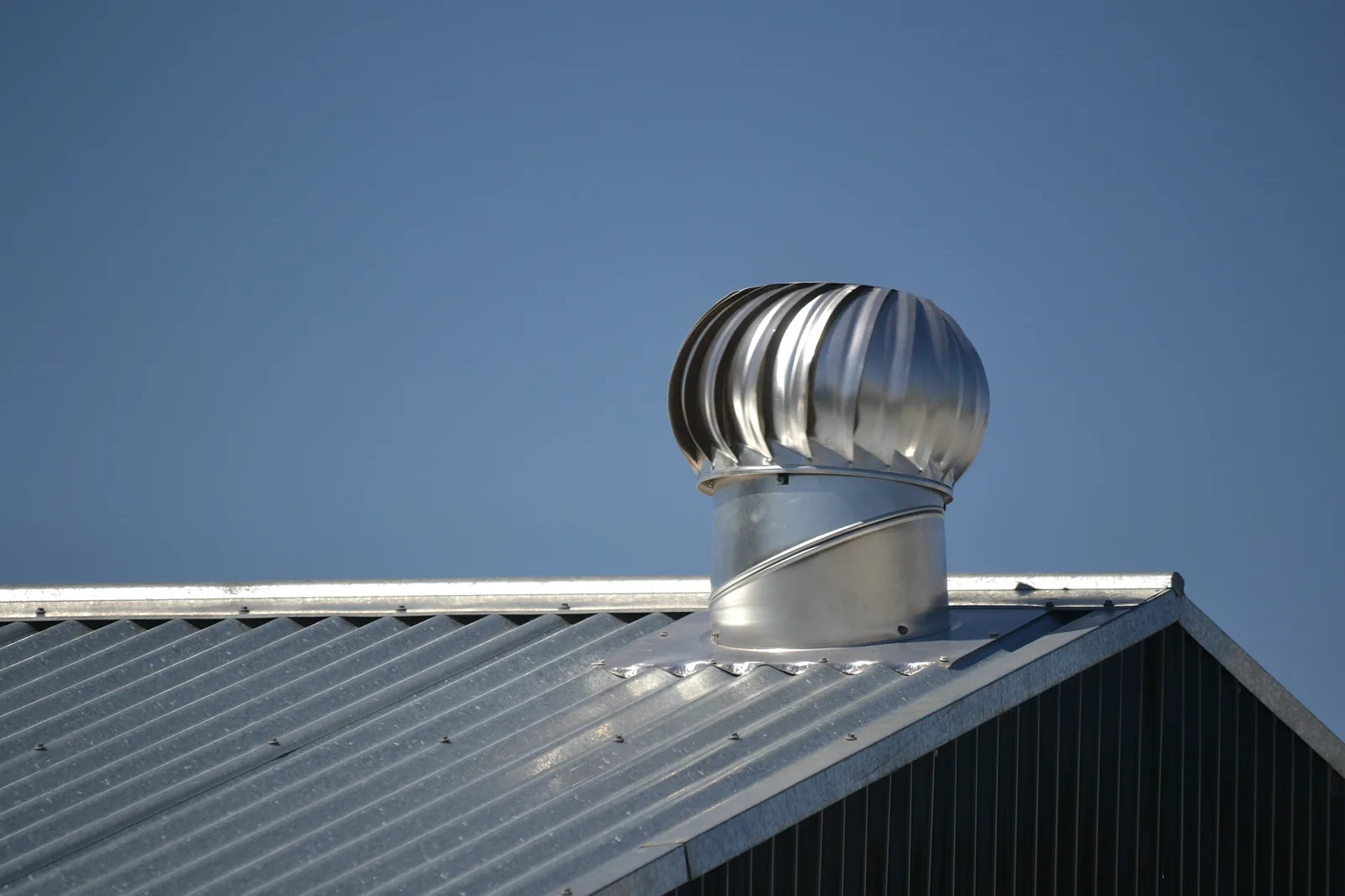 Standing-seam metal roof installed by Total Restoration & Roofing on a Colorado Springs home — 50-year hail-resistant roofing
